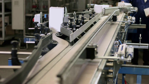 Palettierer für Karton - Sinterpack - Roboter / für Kisten / automatisch