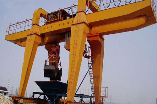 Schienenmontierter Portalkran - Henan Kuangshan Crane Co., Ltd. - Schweiß / für Greifer / Hänge