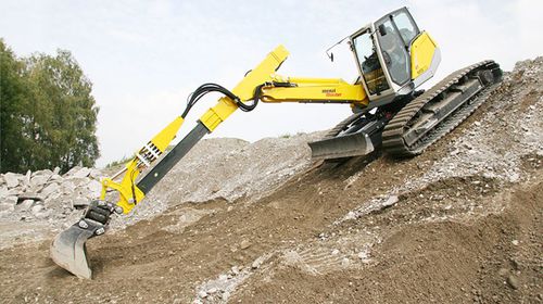 Mittelgroßer Bagger - M515 - Menzimuck - auf Raupen / Diesel / mit Teleskoparm