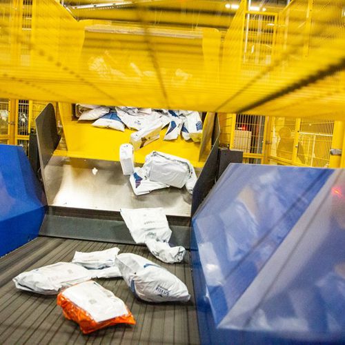 Entladungssystem für Päckchen - VANDERLANDE - für LKW / für Paletten / korb