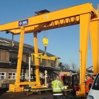 Schienenmontierter Portalkran - ADC - für Schifffahrtsanwendungen / für Modulgebäudebau / für Schiffsentladung